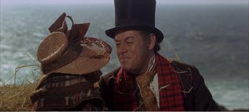 Movie still from “Doctor Dolittle” (1967), directed by Richard Fleischer – A person wearing a top hat; Close Up shot, Over the shoulder angle