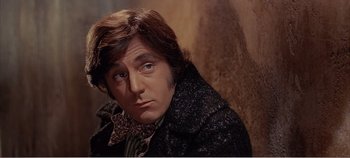 Movie still from “Doctor Dolittle” (1967), directed by Richard Fleischer – A person with long hair wearing a jacket; Close Up shot, High angle