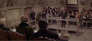 Movie still from “Doctor Dolittle” (1967), directed by Richard Fleischer – A group of people standing in front of a group of people; Wide shot, High angle