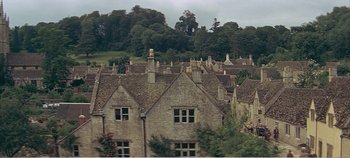Movie still from “Doctor Dolittle” (1967), directed by Richard Fleischer – An aerial view of a town with a bunch of houses; Extreme Wide shot, High angle