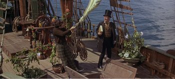 Movie still from “Doctor Dolittle” (1967), directed by Richard Fleischer – Two men on a boat in the water; Wide shot, High angle