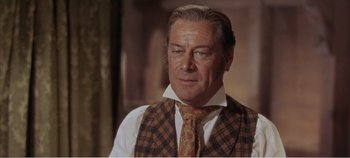 Movie still from “Doctor Dolittle” (1967), directed by Richard Fleischer – An older man wearing a plaid vest and tie; Close Up shot, Low angle