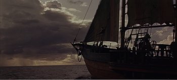 Movie still from “Doctor Dolittle” (1967), directed by Richard Fleischer – A sail boat sailing on the ocean under a cloudy sky; Extreme Wide shot, Low angle