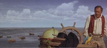 Movie still from “Doctor Dolittle” (1967), directed by Richard Fleischer – A boat with a steering wheel on the water; Extreme Wide shot, High angle