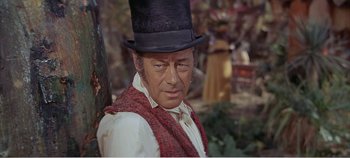 Movie still from “Doctor Dolittle” (1967), directed by Richard Fleischer – A man in a top hat and a red scarf; Close Up shot, Over the shoulder angle