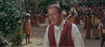 Movie still from “Doctor Dolittle” (1967), directed by Richard Fleischer – A person wearing a suit and tie; Medium shot, Over the shoulder angle