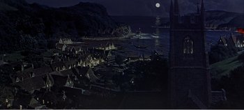 Movie still from “Doctor Dolittle” (1967), directed by Richard Fleischer – A view of a city at night with a full moon in the background; Extreme Wide shot, High angle
