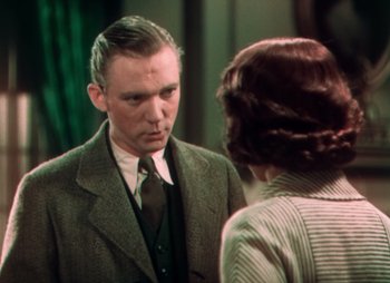 Movie still from “Doctor X” (1932), directed by Michael Curtiz – A man and a woman are looking at one another; Medium shot, Over the shoulder angle