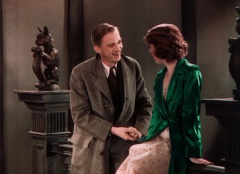 Movie still from “Doctor X” (1932), directed by Michael Curtiz – A man and a woman talking to each other; Medium shot, High angle