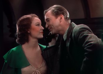 Movie still from “Doctor X” (1932), directed by Michael Curtiz – A man and a woman standing next to each other; Medium shot, Low angle