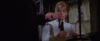 Movie still from “Doctor Zhivago” (1965), directed by David Lean – A woman in a white shirt and a man in a black tie; Close Up shot, Over the shoulder angle