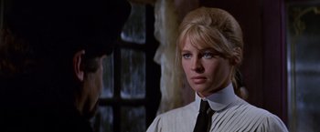 Movie still from “Doctor Zhivago” (1965), directed by David Lean – A woman wearing a black tie standing next to a man; Close Up shot, Over the shoulder angle