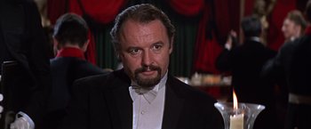 Movie still from “Doctor Zhivago” (1965), directed by David Lean – A person wearing a suit and a bow tie; Close Up shot, Low angle