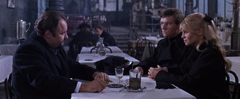 Movie still from “Doctor Zhivago” (1965), directed by David Lean – Two men sitting at a table with a glass of wine; Medium shot, Over the shoulder angle