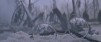 Movie still from “Doctor Zhivago” (1965), directed by David Lean – A pair of glasses sitting on top of snow covered ground; Extreme Close Up shot, High angle