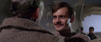 Movie still from “Doctor Zhivago” (1965), directed by David Lean – A person with a mustache looking at another person; Close Up shot, Over the shoulder angle