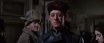 Movie still from “Doctor Zhivago” (1965), directed by David Lean – A man wearing a hat with a red star on it; Close Up shot, Low angle