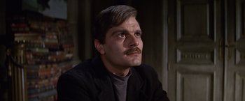 Movie still from “Doctor Zhivago” (1965), directed by David Lean – A person with a mustache wearing a suit; Close Up shot, Low angle