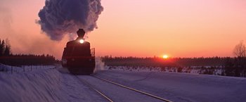 Movie still from “Doctor Zhivago” (1965), directed by David Lean – A train traveling down train tracks in the snow; Extreme Wide shot, Low angle