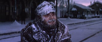 Movie still from “Doctor Zhivago” (1965), directed by David Lean – A man in a hat and jacket in the snow; Close Up shot, Low angle