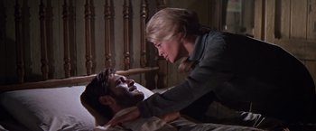 Movie still from “Doctor Zhivago” (1965), directed by David Lean – A man and a woman are laying in a bed; Medium shot, Low angle