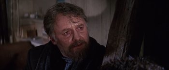 Movie still from “Doctor Zhivago” (1965), directed by David Lean – An old man with a beard and a mustache is looking at the camera; Close Up shot, Low angle