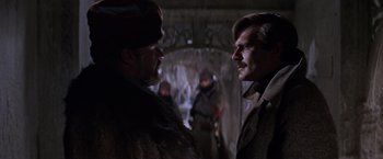 Movie still from “Doctor Zhivago” (1965), directed by David Lean – Two men are standing in front of each other; Close Up shot, Over the shoulder angle