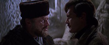 Movie still from “Doctor Zhivago” (1965), directed by David Lean – A man and a man face to face in a cave; Close Up shot, Over the shoulder angle