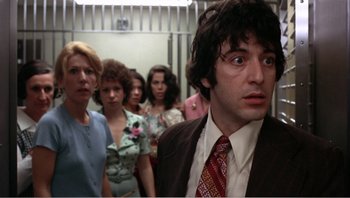 Movie still from “Dog Day Afternoon” (1975), directed by Sidney Lumet – A group of people standing in a room; Close Up shot, Low angle