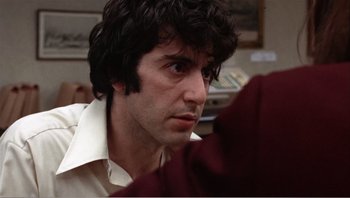 Movie still from “Dog Day Afternoon” (1975), directed by Sidney Lumet – A person wearing a white shirt; Close Up shot, Low angle