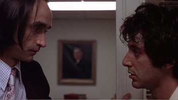 Movie still from “Dog Day Afternoon” (1975), directed by Sidney Lumet – Two men in a room talking to each other; Close Up shot, Low angle