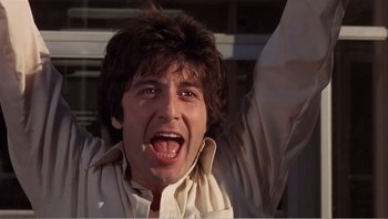 Movie still from “Dog Day Afternoon” (1975), directed by Sidney Lumet – A person wearing a white shirt with his mouth wide open; Close Up shot, Low angle
