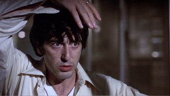 Movie still from “Dog Day Afternoon” (1975), directed by Sidney Lumet – A person with his hand on his head; Close Up shot, Over the shoulder angle