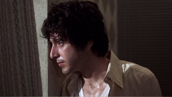 Movie still from “Dog Day Afternoon” (1975), directed by Sidney Lumet – A person wearing a shirt and jacket; Close Up shot, Low angle