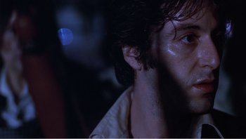 Movie still from “Dog Day Afternoon” (1975), directed by Sidney Lumet – A man's face in the dark; Close Up shot, Low angle