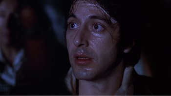 Movie still from “Dog Day Afternoon” (1975), directed by Sidney Lumet – A person looking up at something; Close Up shot, Low angle