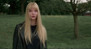 Movie still from “The New Mutants” (2020), directed by Josh Boone – A woman with long blonde hair wearing a leather jacket; Close Up shot, Low angle