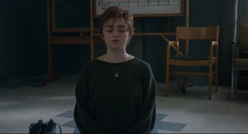 Movie still from “The New Mutants” (2020), directed by Josh Boone – A young boy is sitting in a room with his eyes closed; Medium shot, Over the shoulder angle