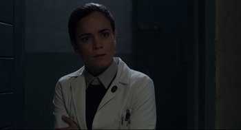 Movie still from “The New Mutants” (2020), directed by Josh Boone – A woman in a white lab coat and a tie; Close Up shot, Over the shoulder angle