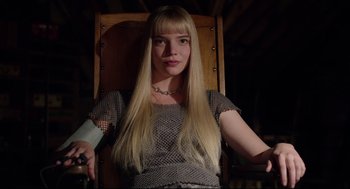 Movie still from “The New Mutants” (2020), directed by Josh Boone – A woman sitting in a chair holding a wii controller; Medium shot, Low angle
