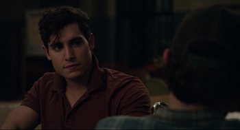 Movie still from “The New Mutants” (2020), directed by Josh Boone – A man sitting in front of another man in front of a table; Close Up shot, Over the shoulder angle