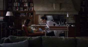 Movie still from “The New Mutants” (2020), directed by Josh Boone – A woman in a white shirt is talking to a child; Medium shot, Over the shoulder angle