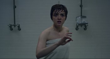 Movie still from “The New Mutants” (2020), directed by Josh Boone – A young woman wrapped in a towel in a bathroom; Medium shot, Over the shoulder angle