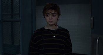 Movie still from “The New Mutants” (2020), directed by Josh Boone – A young woman with short brown hair wearing a striped shirt; Medium shot, High angle