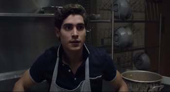 Movie still from “The New Mutants” (2020), directed by Josh Boone – A young man wearing an apron in a kitchen; Close Up shot, Low angle