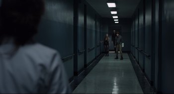 Movie still from “The New Mutants” (2020), directed by Josh Boone – A group of people walking down a long hallway; Wide shot, Over the shoulder angle