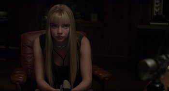 Movie still from “The New Mutants” (2020), directed by Josh Boone – A woman sitting in a chair in a dark room; Close Up shot, Over the shoulder angle