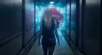 Movie still from “The New Mutants” (2020), directed by Josh Boone – A woman walking down a hall way with smoke coming out of it; Wide shot, Over the shoulder angle