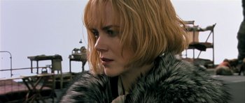 Movie still from “Dogville” (2003), directed by Lars von Trier – A person wearing a fur coat; Close Up shot, Low angle