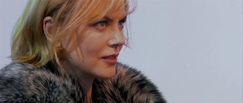 Movie still from “Dogville” (2003), directed by Lars von Trier – A person wearing a fur coat; Close Up shot, Low angle